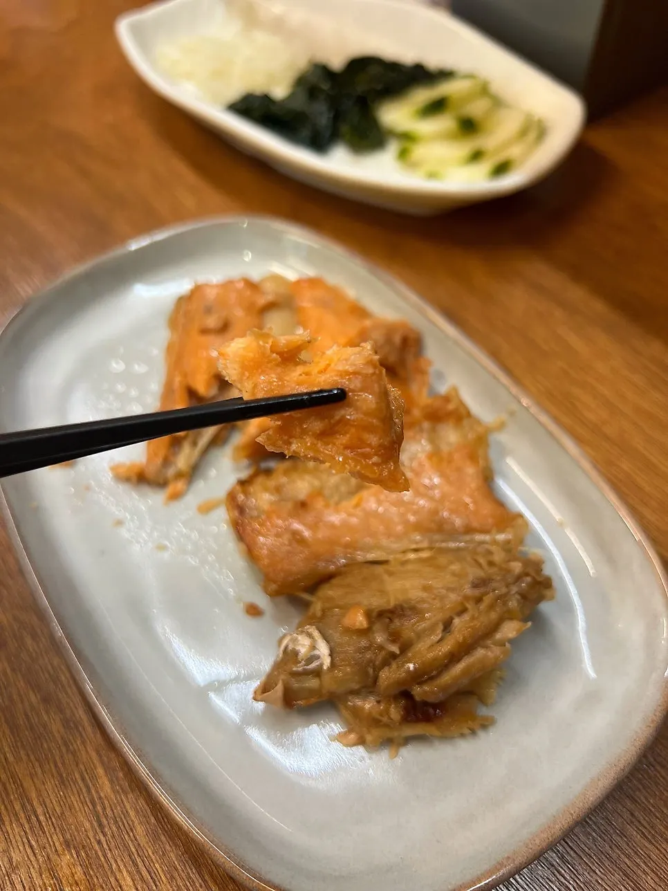 Complimentary grilled fish topped with sweet sauce