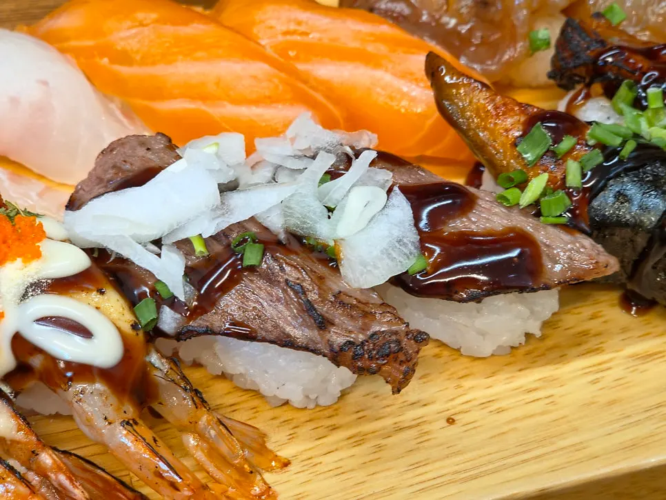 Eel sushi topped with sweet-savory sauce
