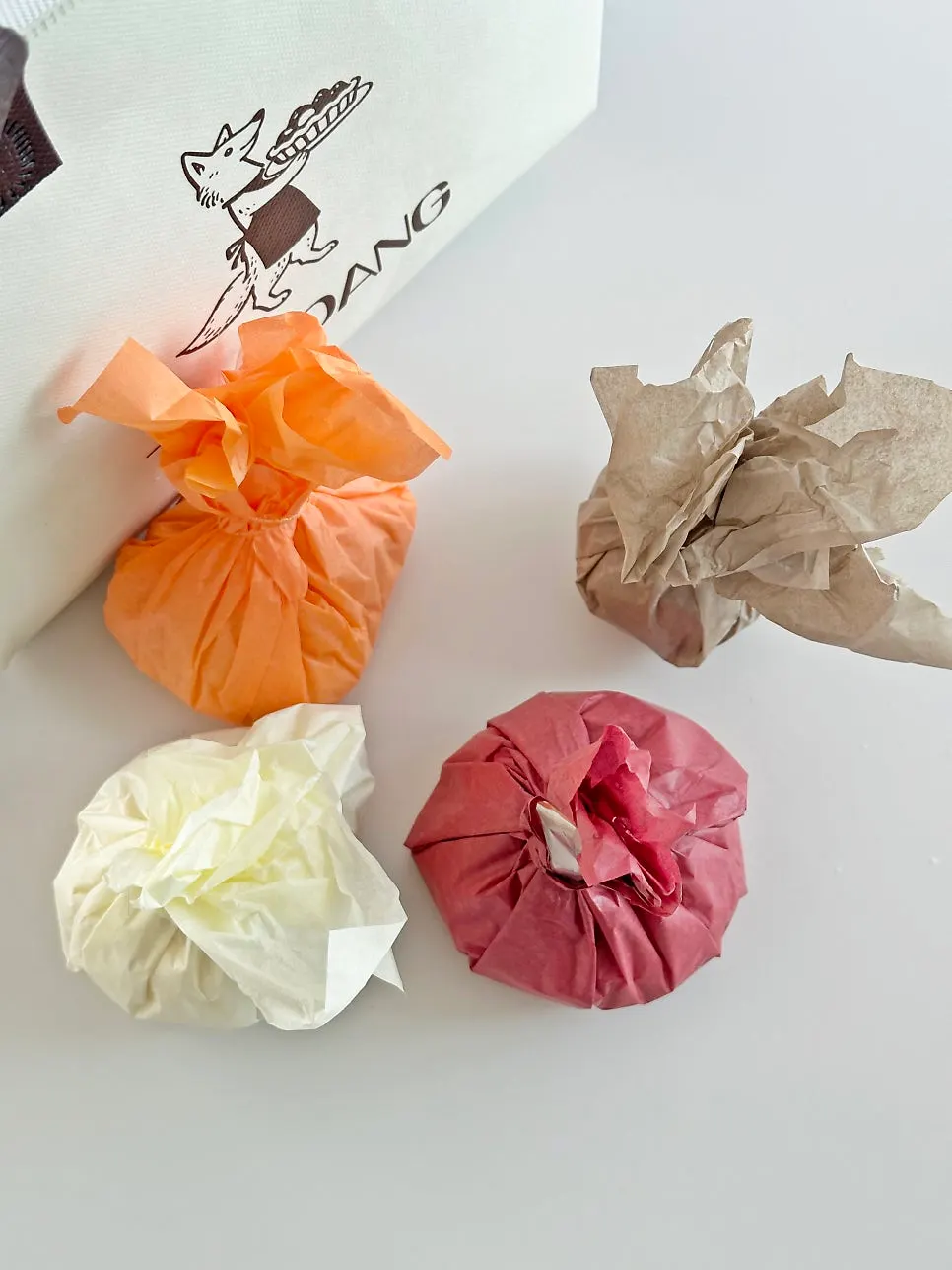 Four Tareudang fruit mochi wrapped in packaging