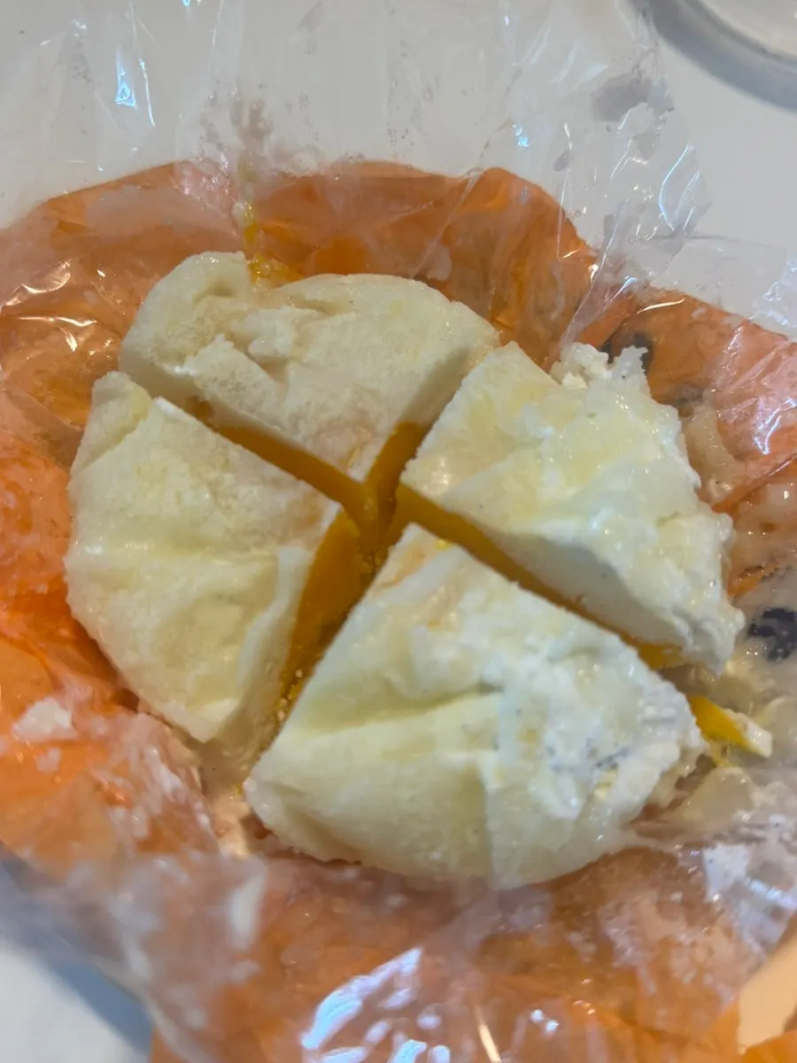 Cold low-sugar mango yogurt mochi being eaten