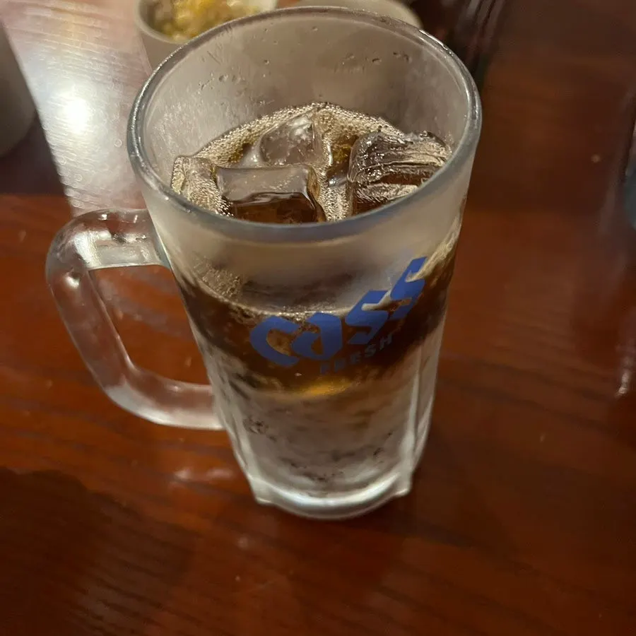 Cola served in a frosted beer mug packed with ice