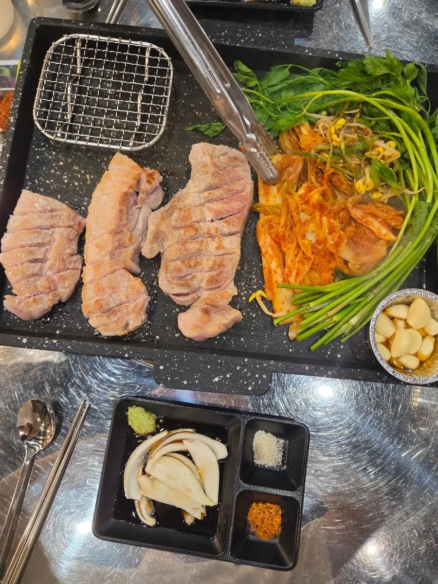 Grilling pork belly at the round table by the terrace