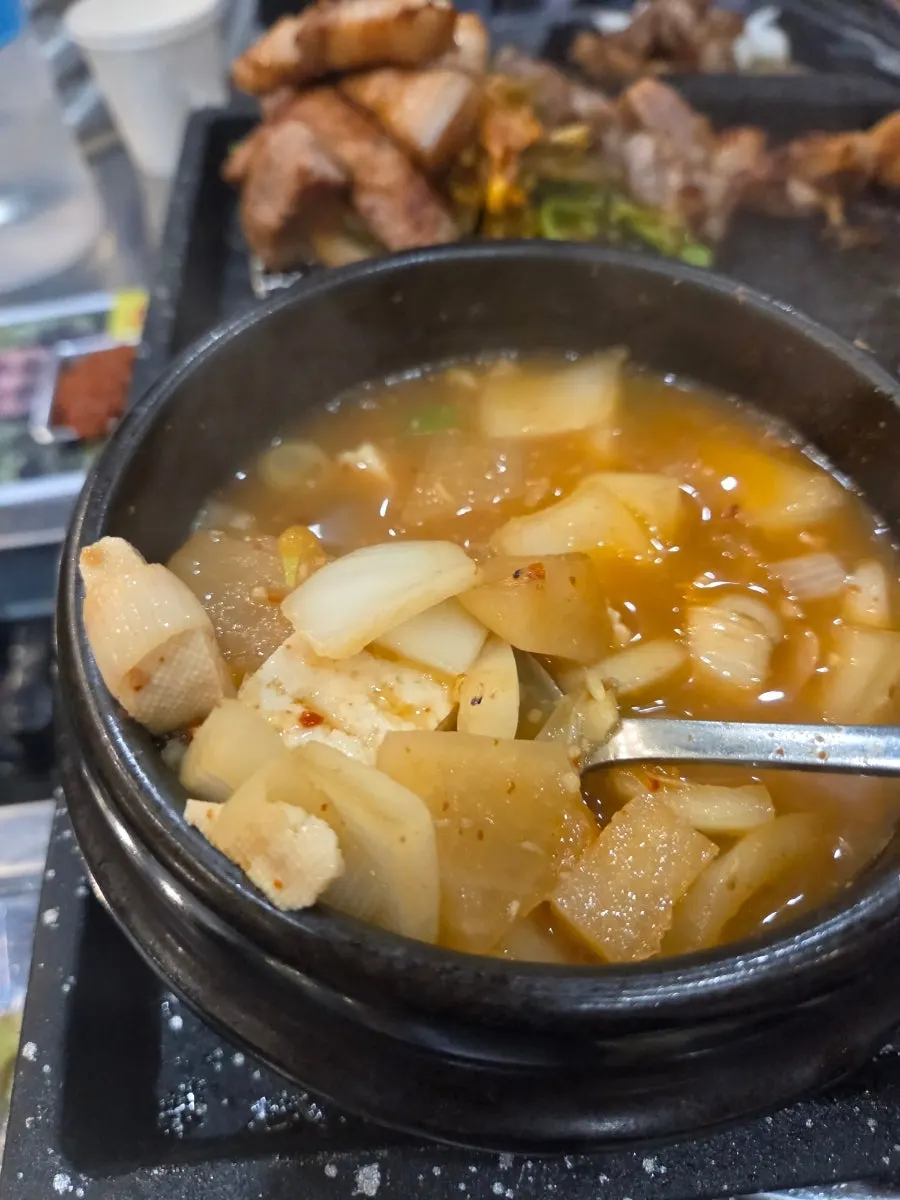 A wrap of pork belly and minari