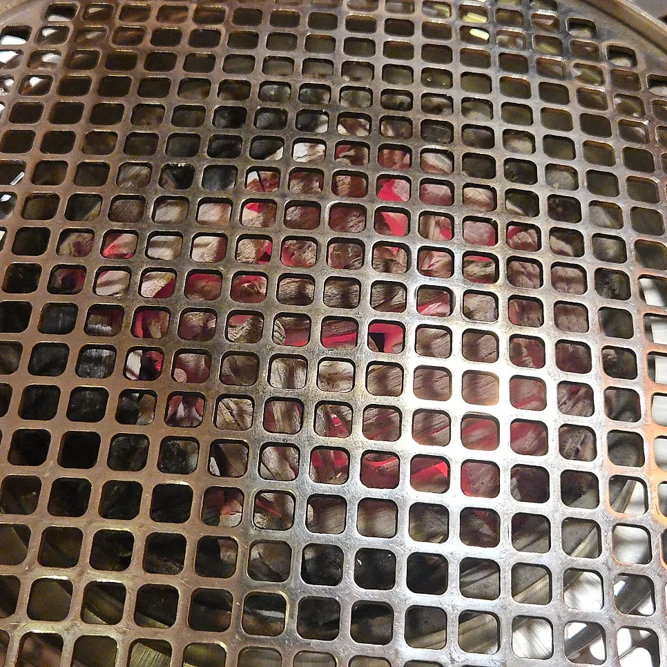 Basic table setting with charcoal ready in the grill and ice water
