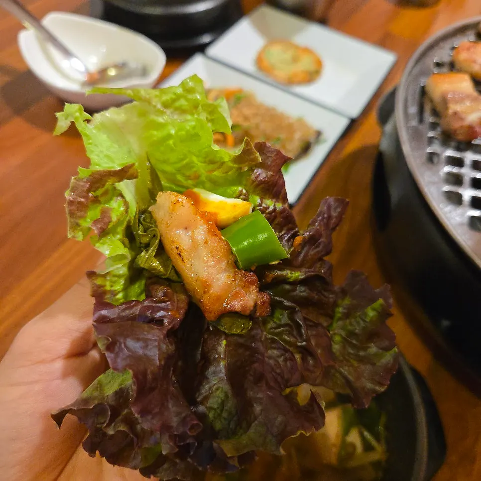 Hangjeongsal cooking on the grill