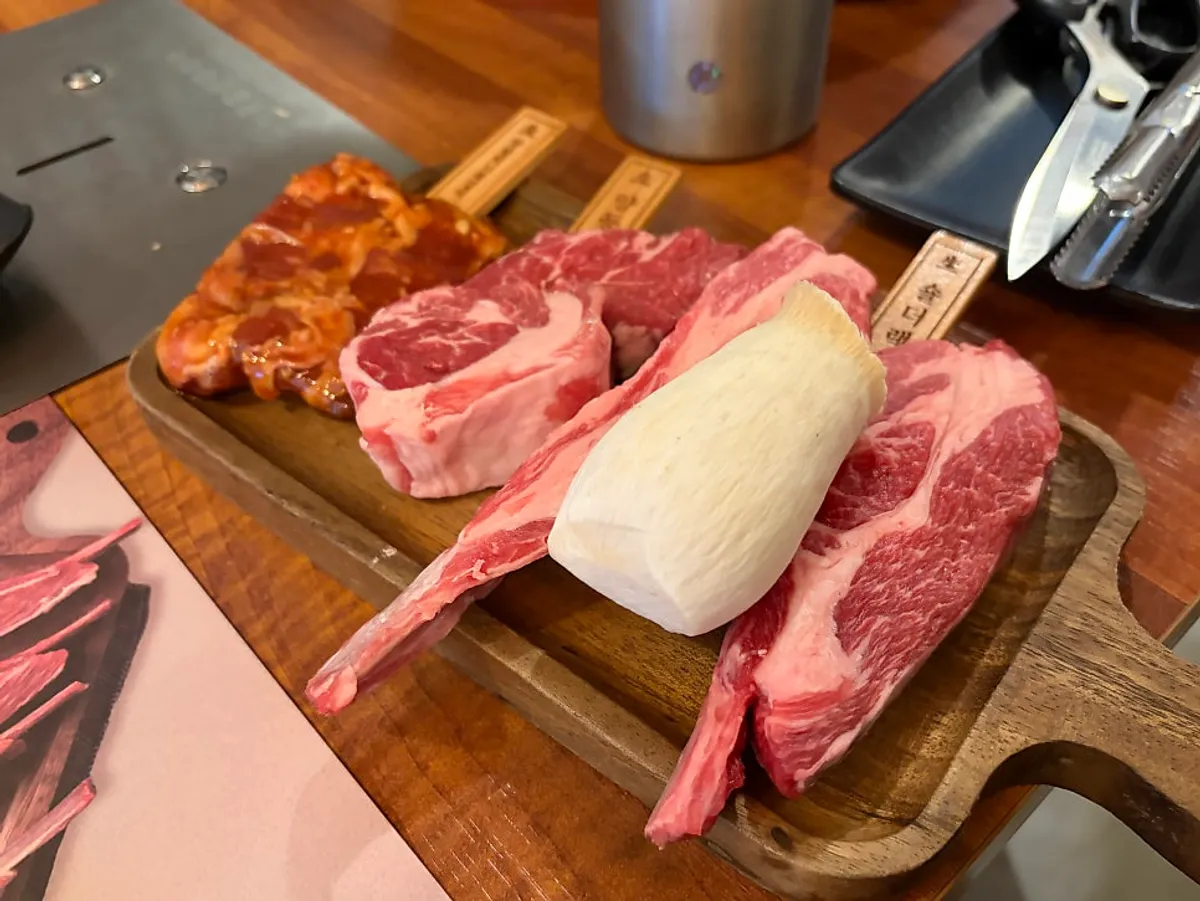 Prepped chilled aged lamb ribs served at the table