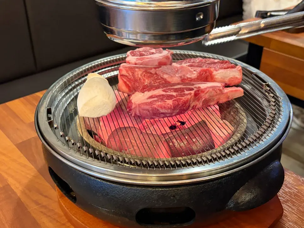 Shoulder rack cooking over charcoal
