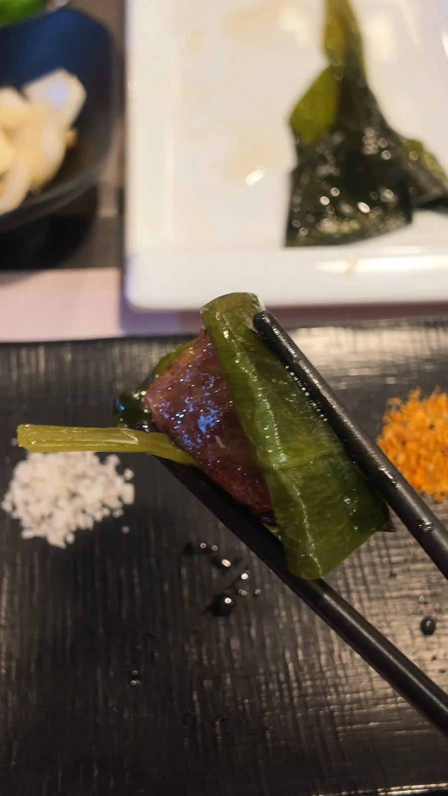 A piece of lamb sirloin with salt and wasabi