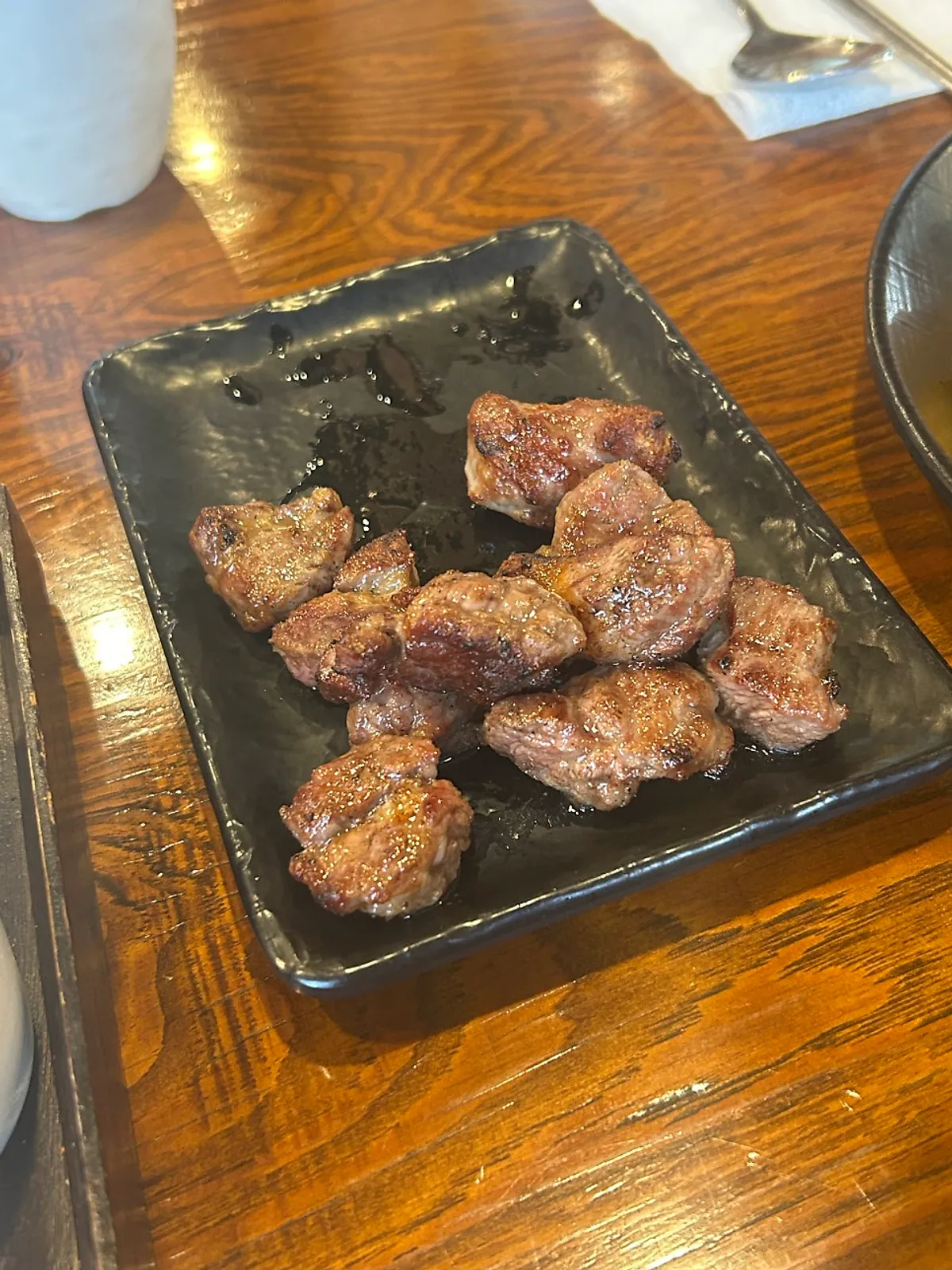 Golden-brown grilled lamb skewers at Hwaro Yangmi
