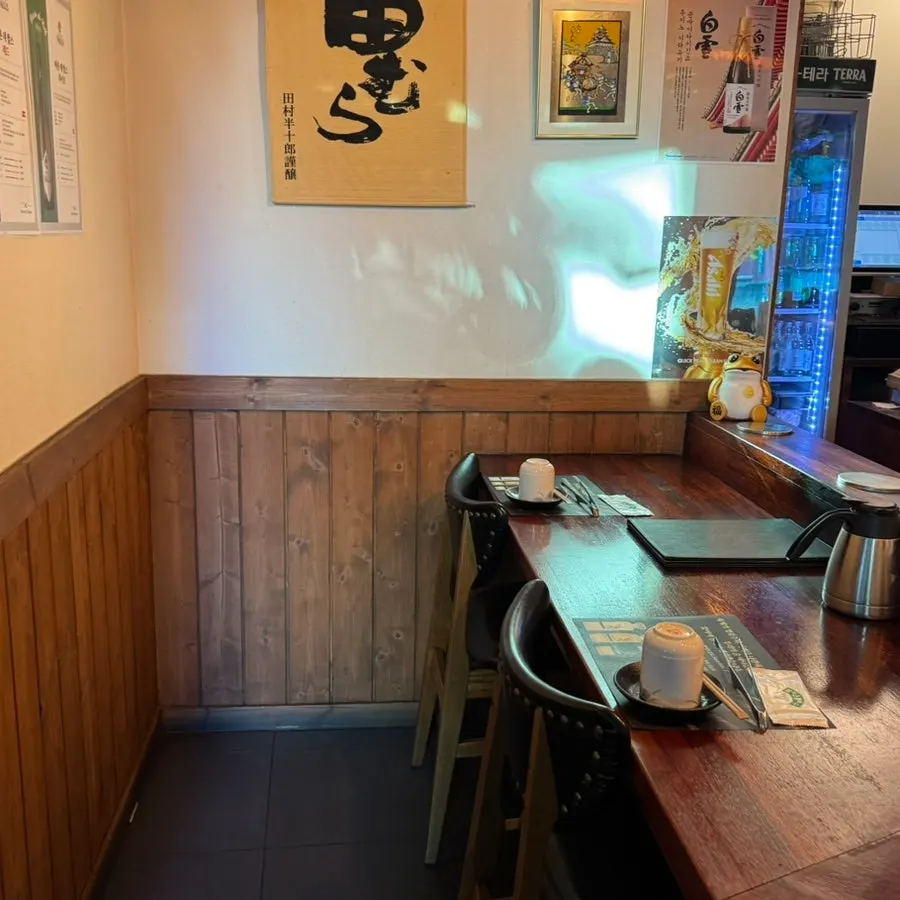 Seating at Hwarodam with a view of the Gwanghwamun streets through the window