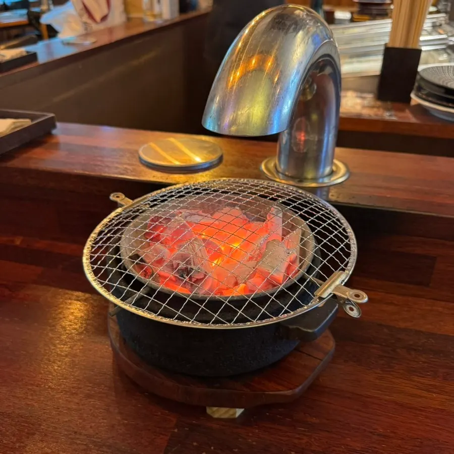 Personal grill at a table in Hwarodam