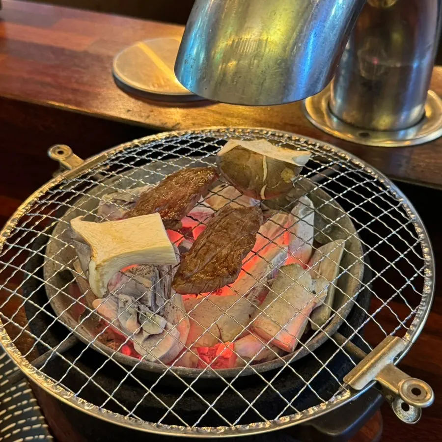 Assorted platter of sirloin, galbisal, salchisal, chicken thigh, and scallops