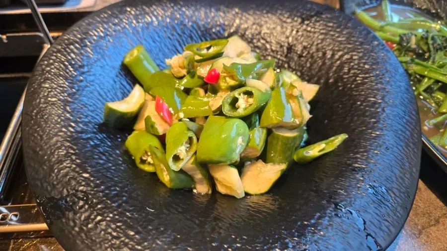 Smashed cucumber tossed with chili peppers