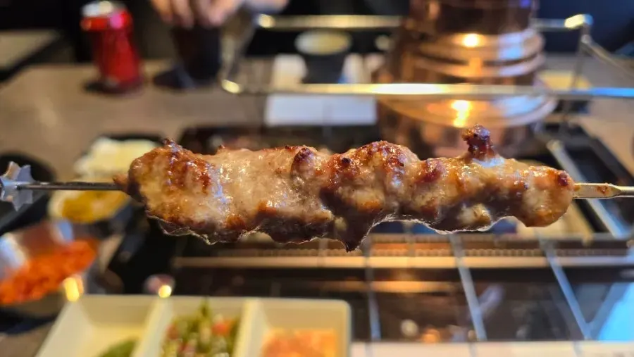 Cross-section of charcoal-grilled sirloin lamb skewer