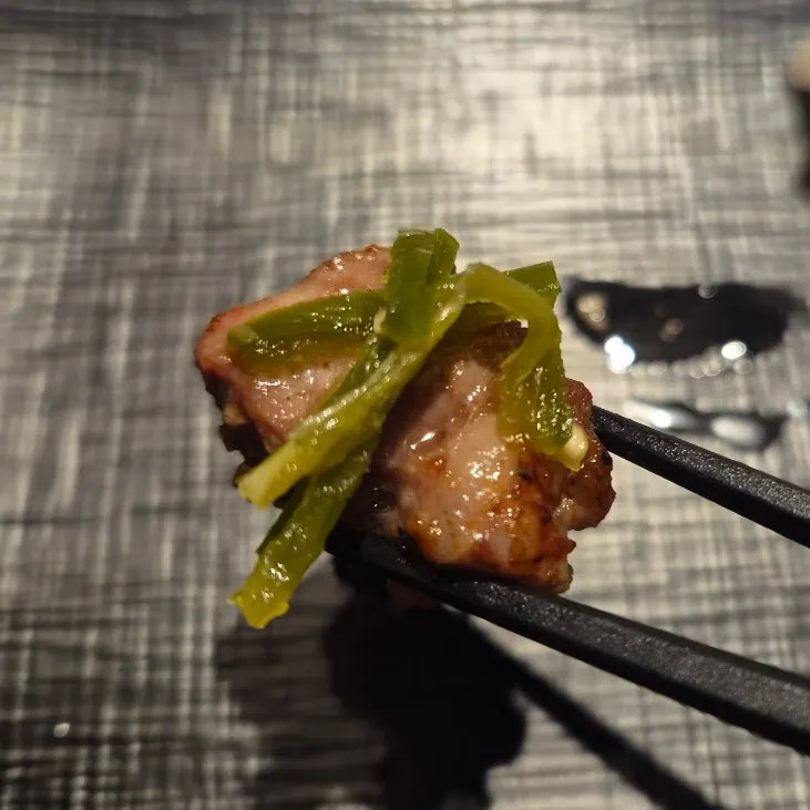 A piece of French rack dipped in salt