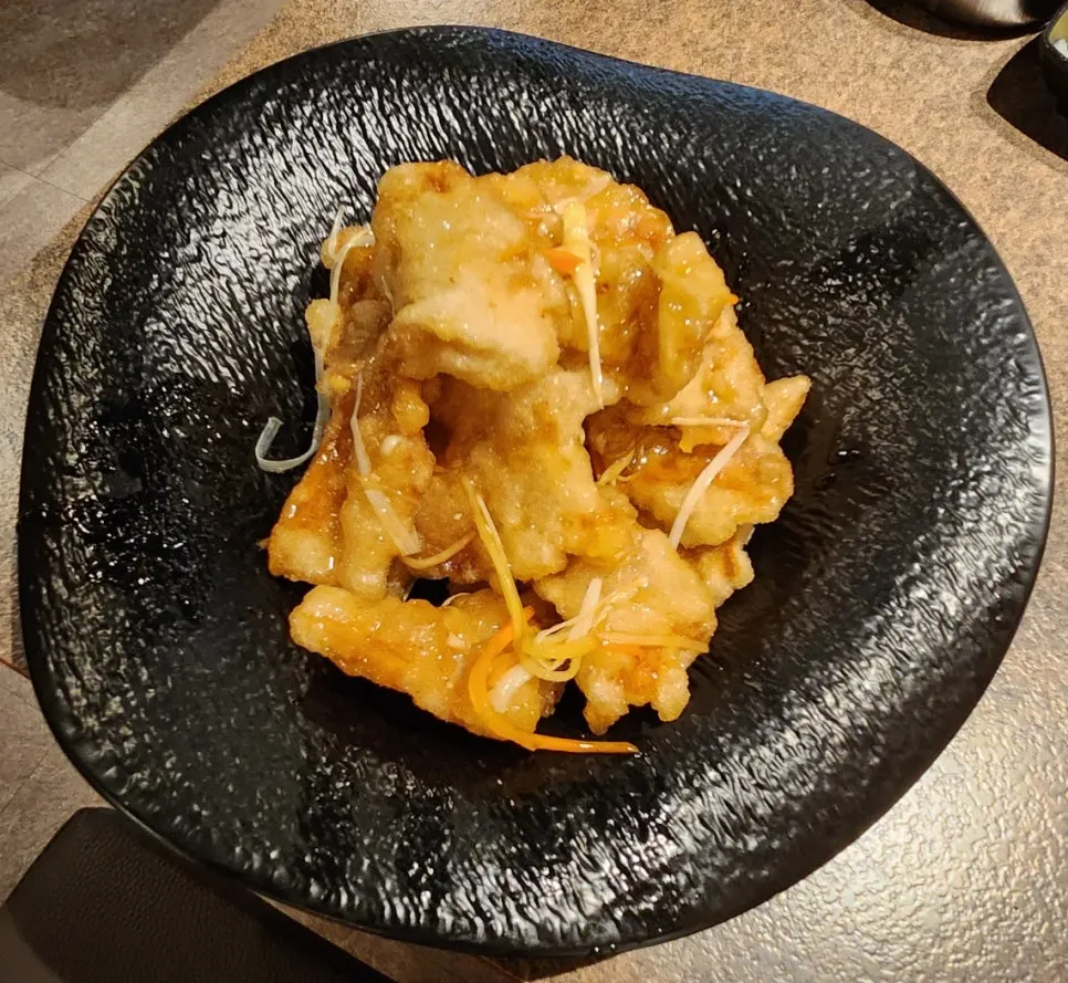 A plate of crispy fried guo bao rou