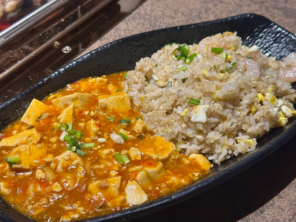 Plate of guo bao rou tossed in sauce