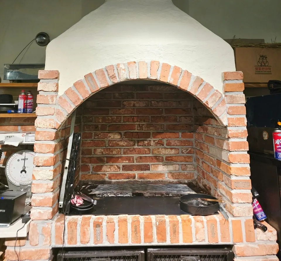 The charcoal fire pit used for pre-grilling inside the restaurant