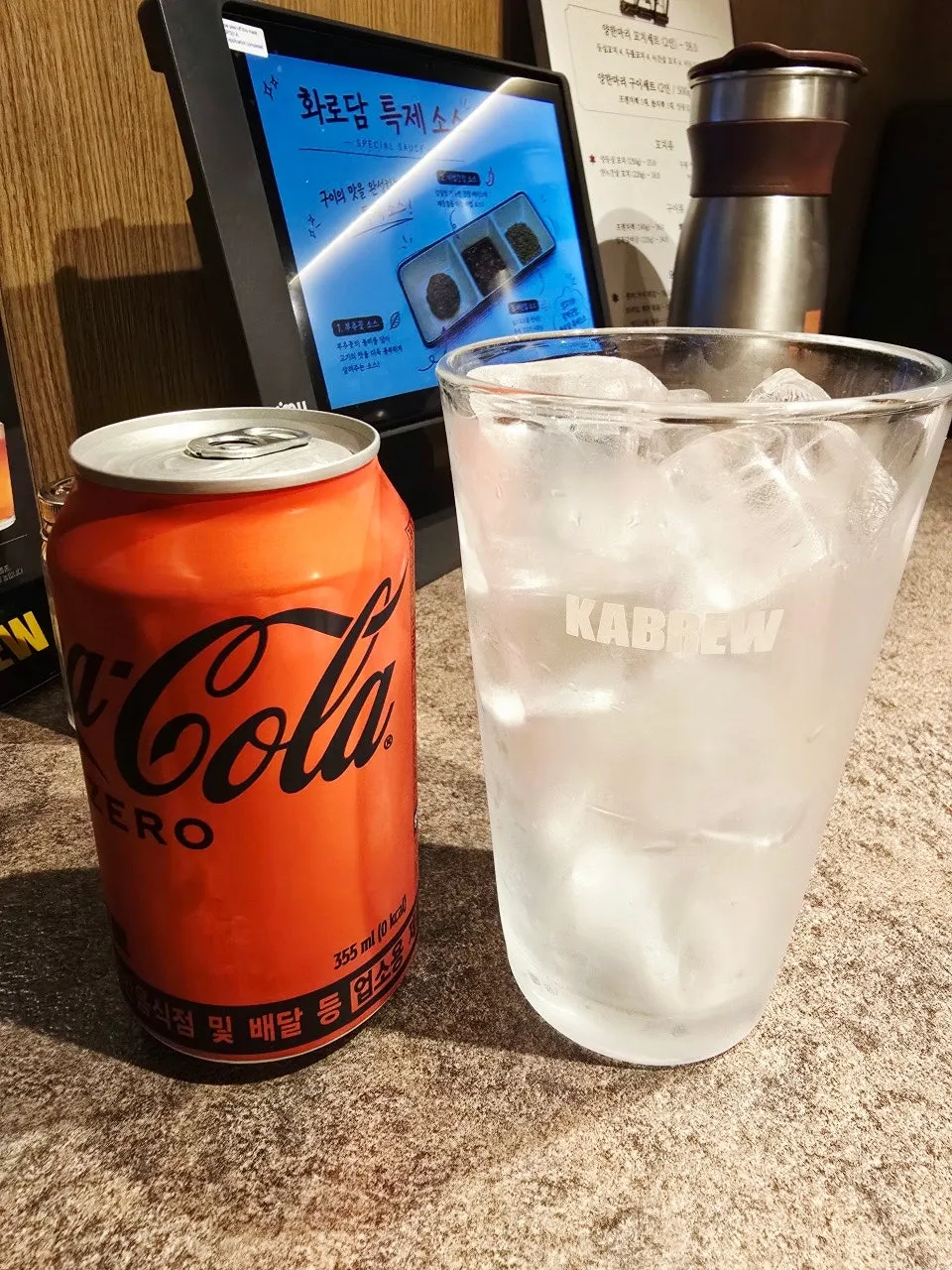 Cola served with a large glass of ice
