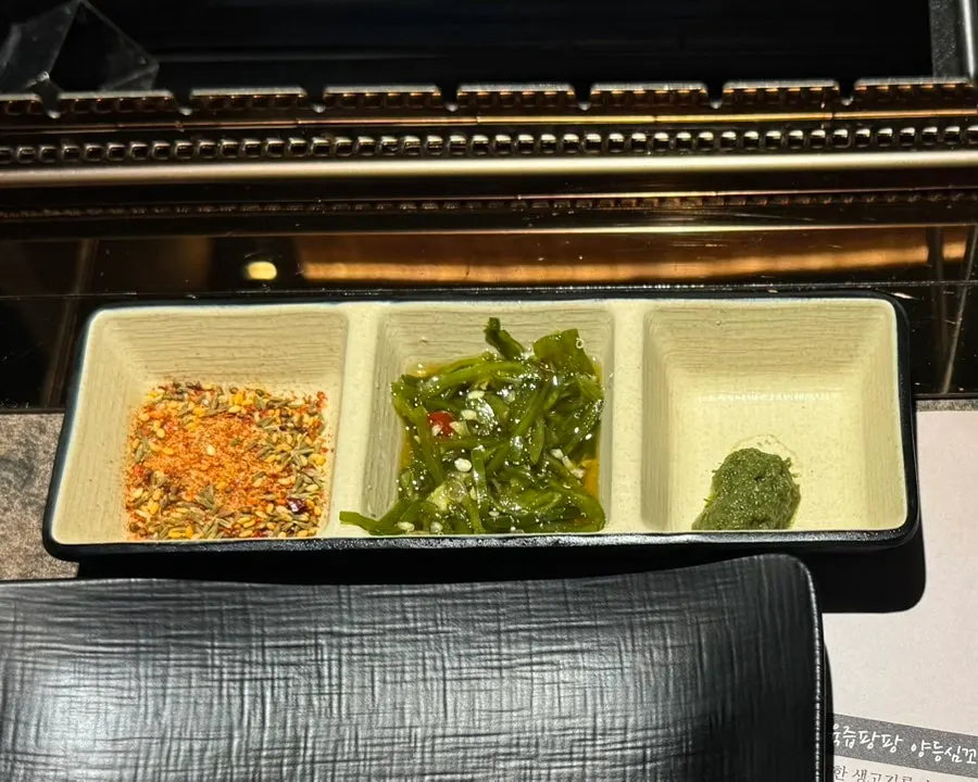 Table setting with cumin, secret sauce, and chive-flower sauce