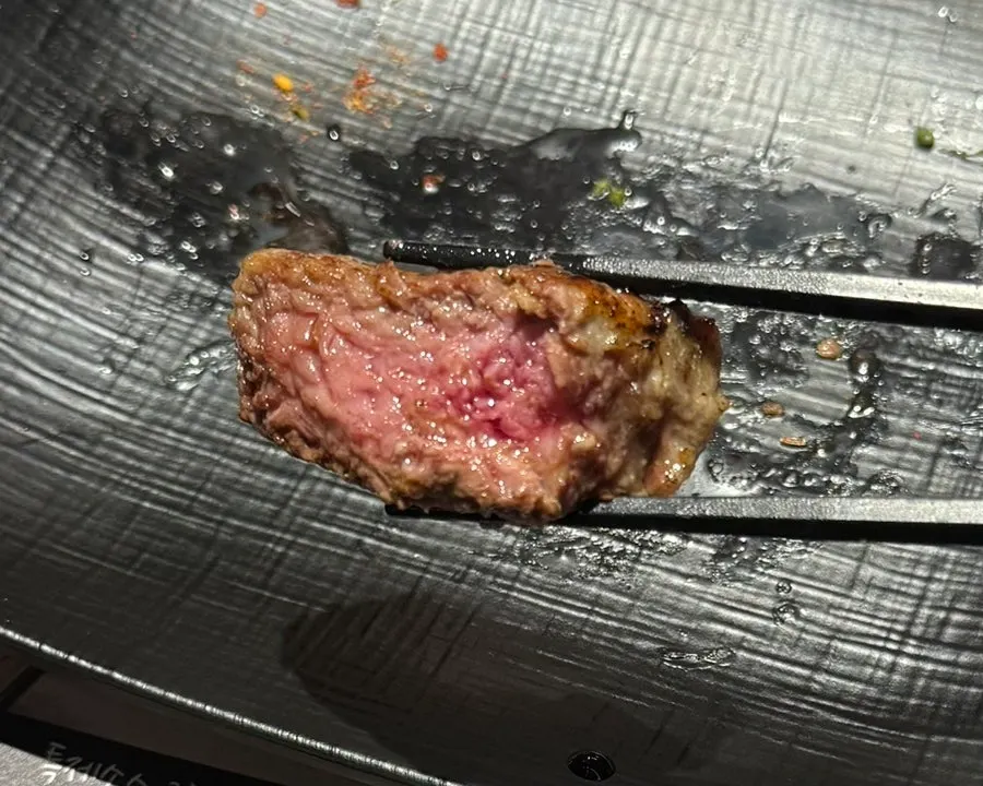 A piece of lamb with sauce