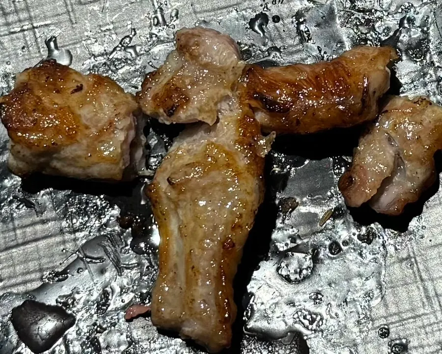 A piece of rib meat removed from the skewer