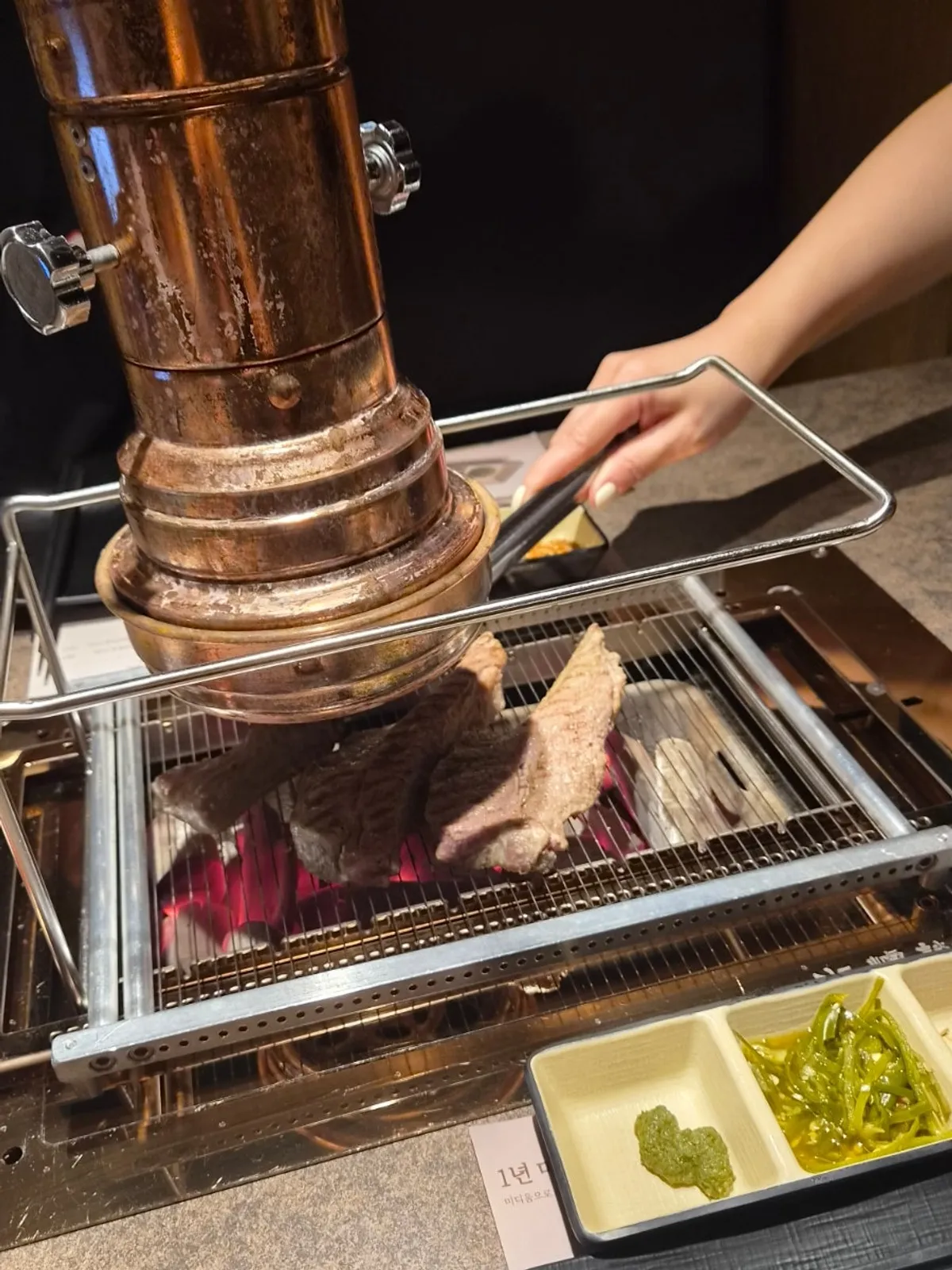 Pre-grilled shoulder rack lamb chops served at the table