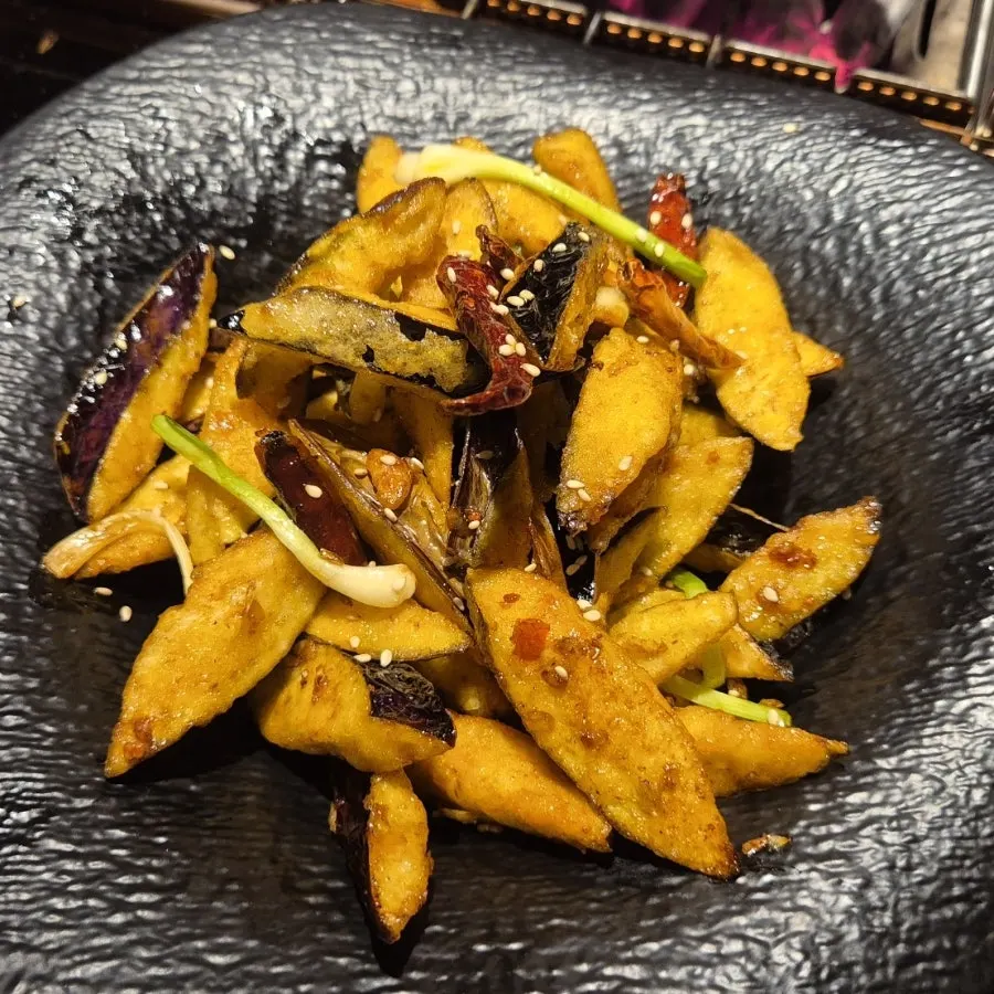 Close-up of eggplant fritters with mala flavor added