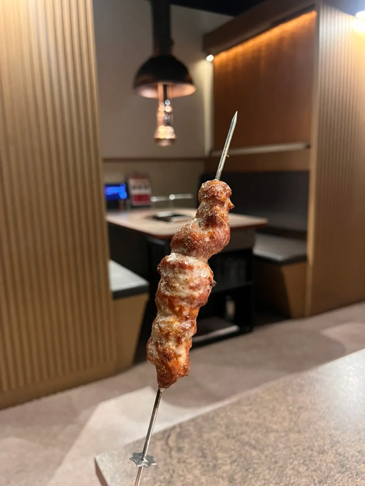 Thick-cut lamb skewers on the table at Hwarodam Yang Kkochi Magok