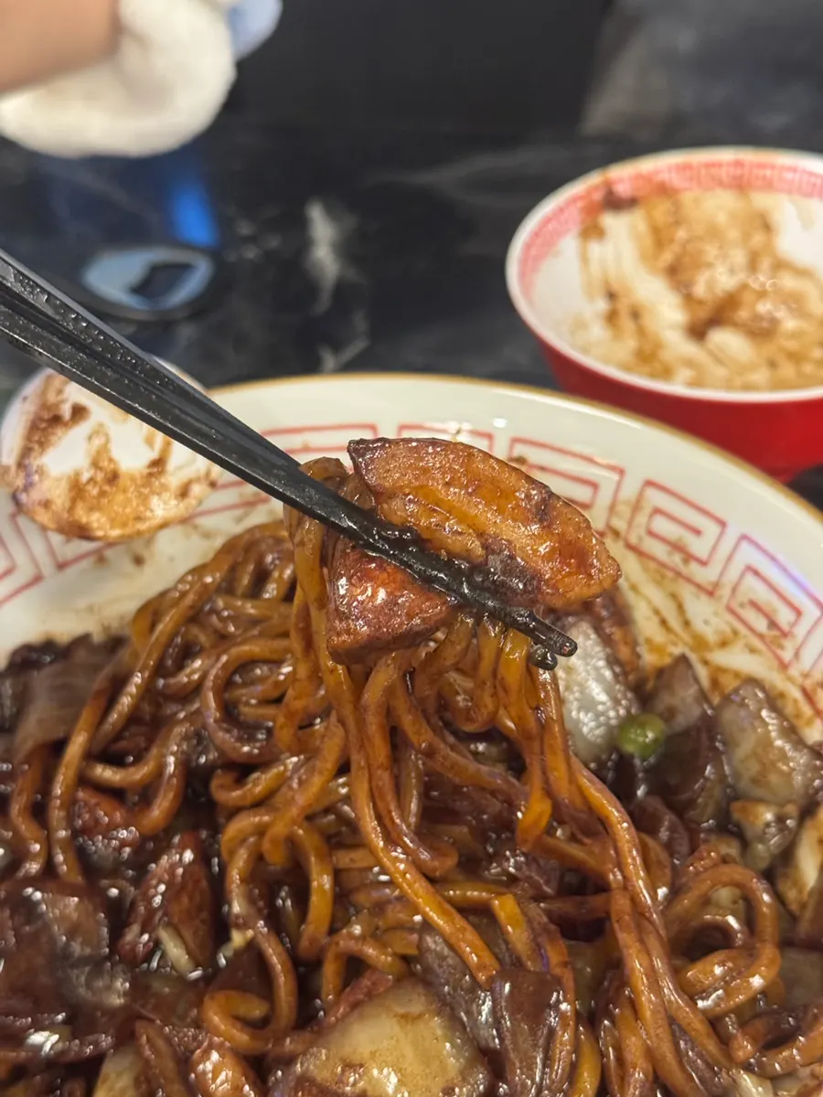 Table with ganjajang and sweet and sour pork side by side