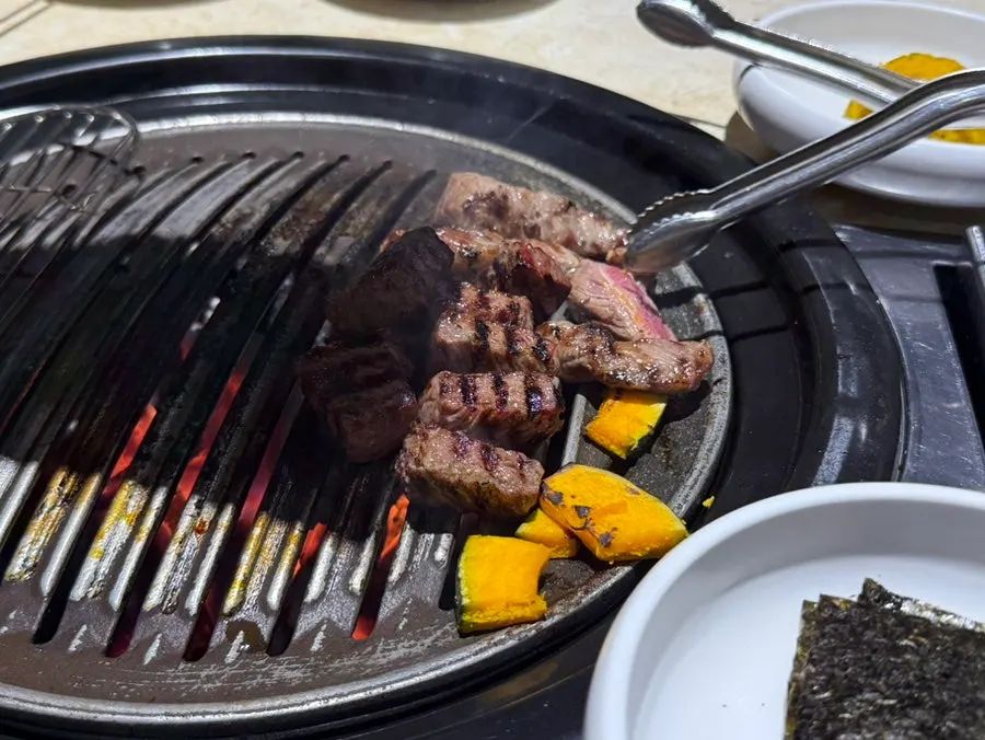 Ribeye grilling on the pan
