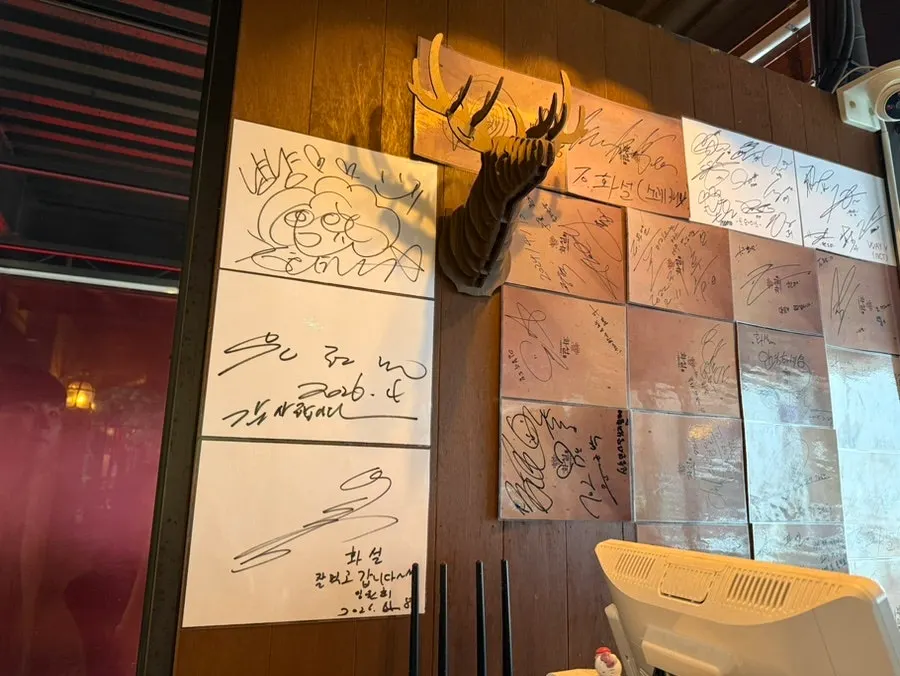 Celebrity autographs on the wall
