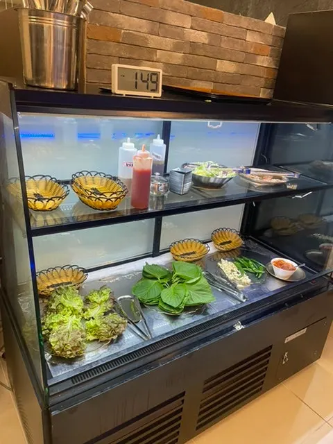 Self-serve bar with wrap vegetables and side dishes