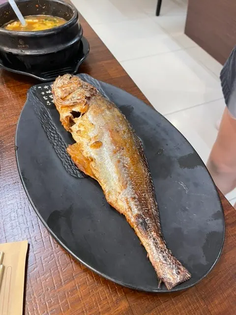 Wood-fired bori-gulbi prepared by a staff member