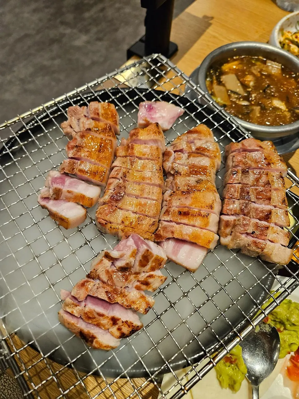 Two packs of bright red pork belly picked from the showcase