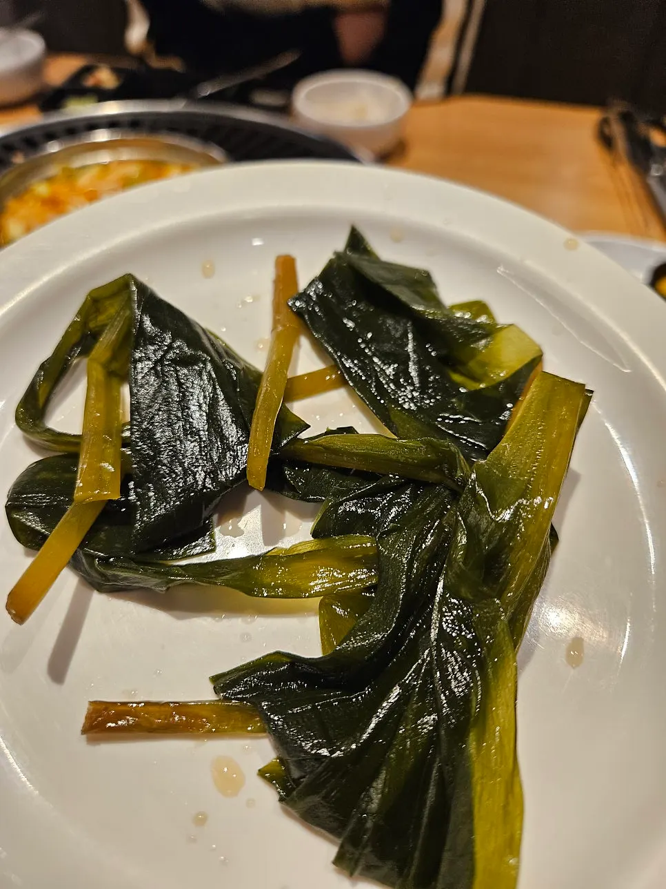 Pickled onion, lettuce, and other side dishes