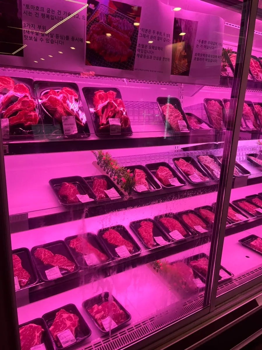 Display case with shrimp meat, rib meat, sirloin and other cuts
