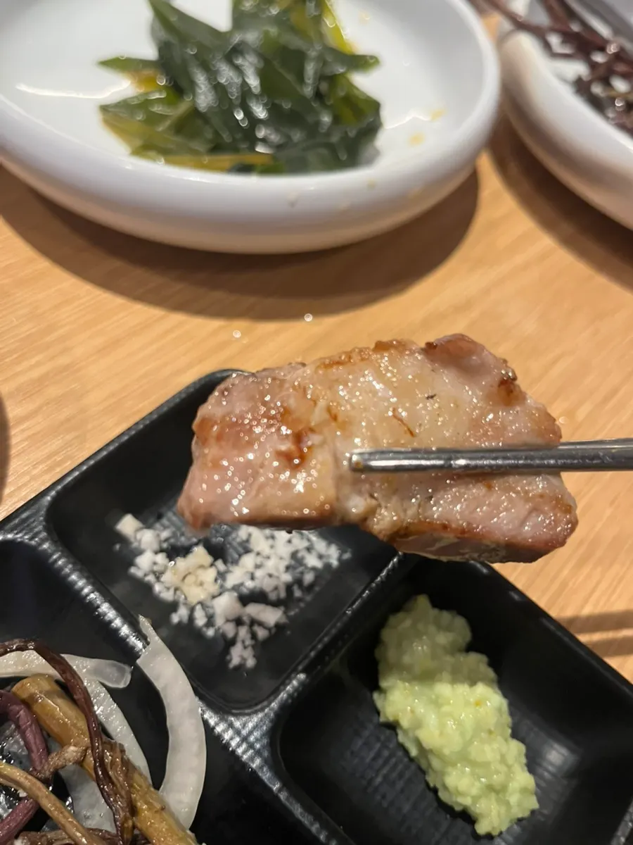 First piece of meat dipped in salt and sesame oil