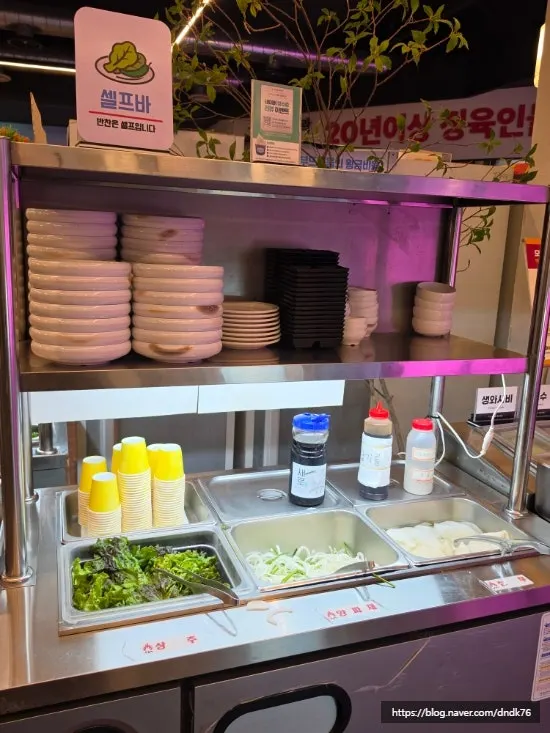 Self-bar stocked with side dishes and sauces