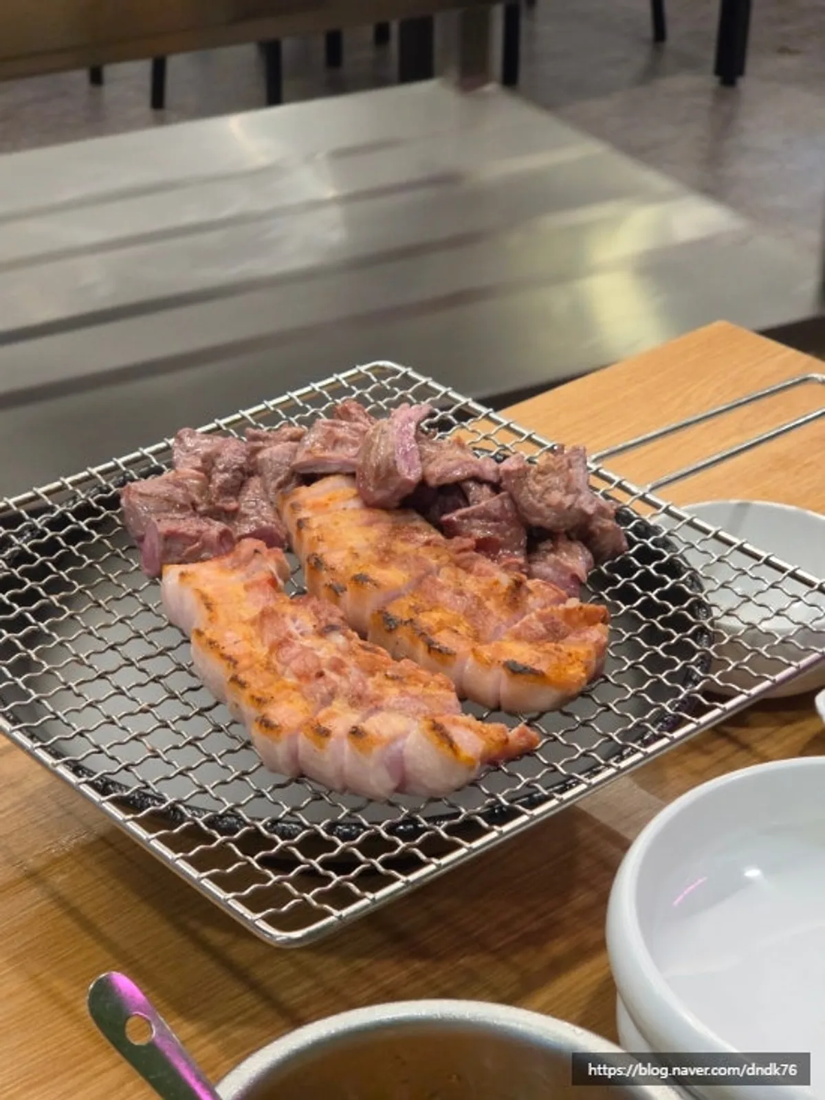 Close-up of pre-grilled meat cut by staff