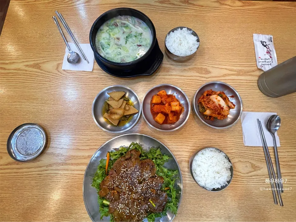Table spread of doganitang and boiled pork with chive salad