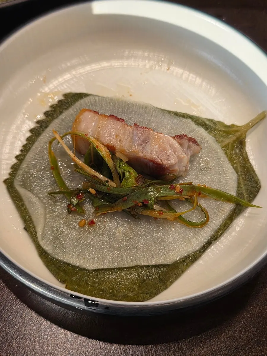 Oak-fired grilled pork belly with a crispy exterior