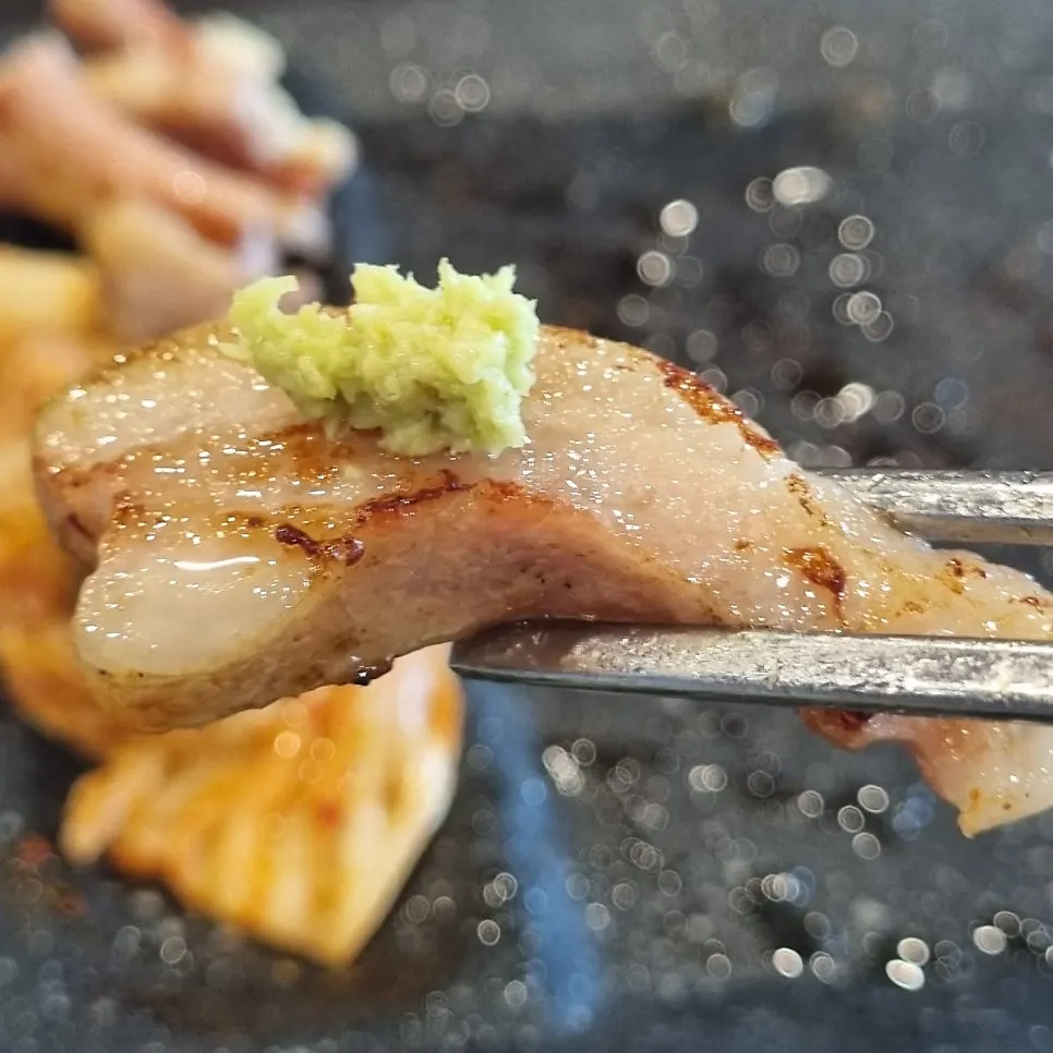 Cross-section of golden-browned pork jowl