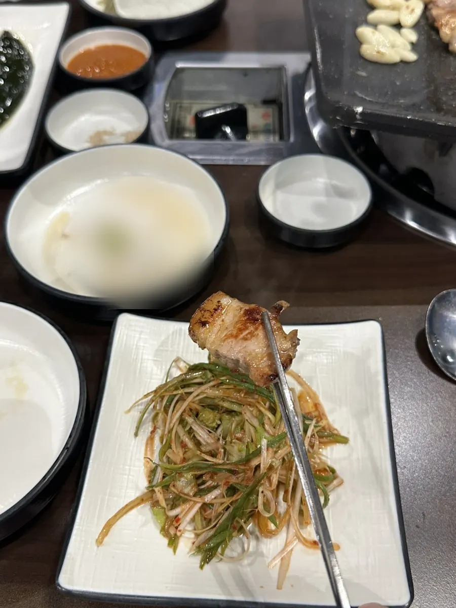 A thick-cut piece of grilled pork neck