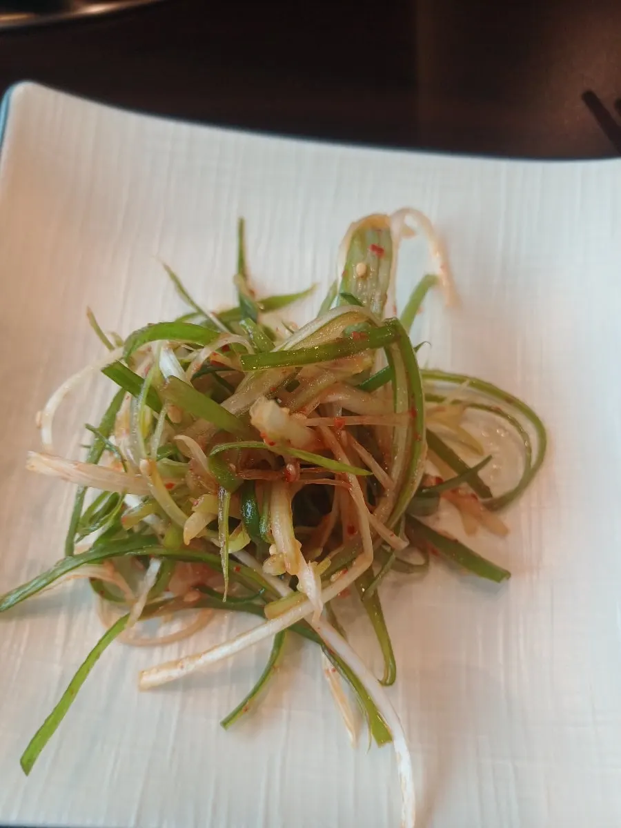 Shredded green onion side dish served as standard