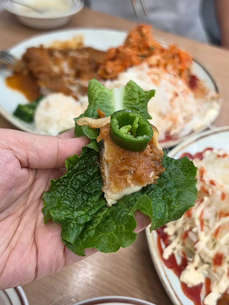 Lettuce wrap with pork cutlet, chili, and ssamjang