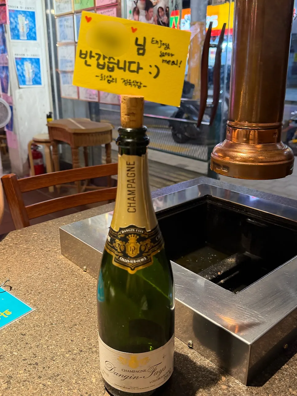 Wine bottle with a handwritten welcome message