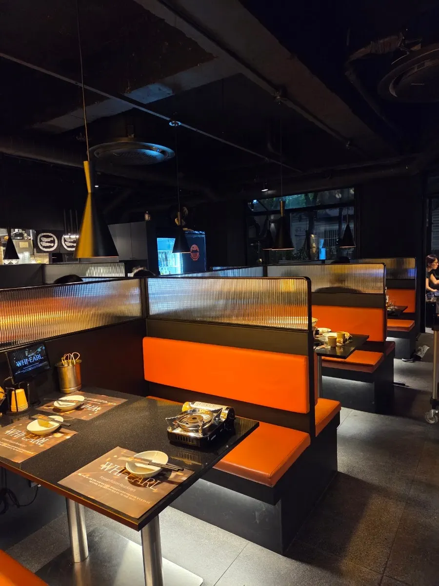 Two-person table under pendant lighting