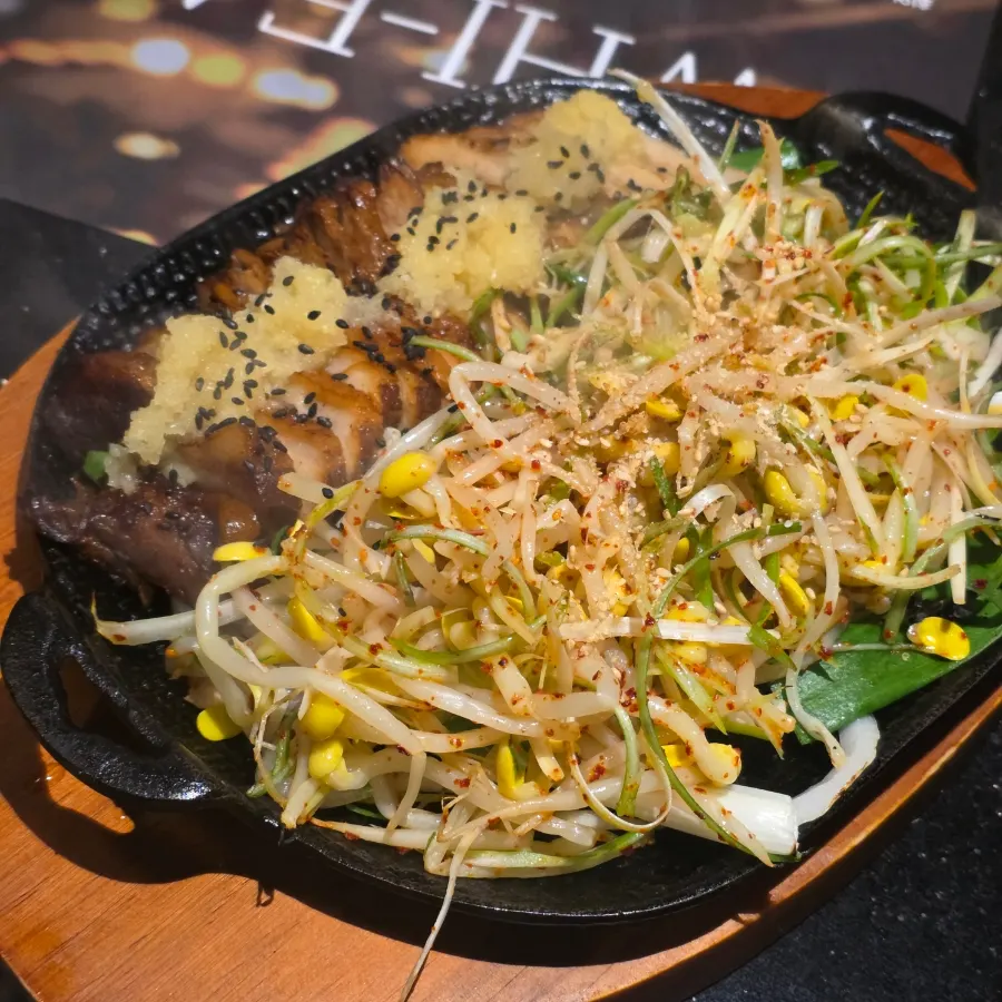 A plate of garlic pork jowl bossam