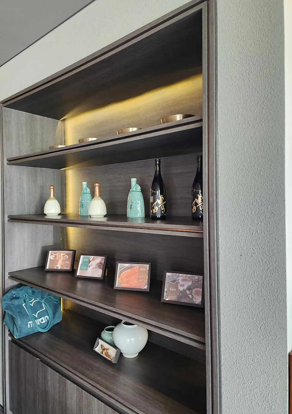Shelf holding bottles of traditional yakju and cheongju